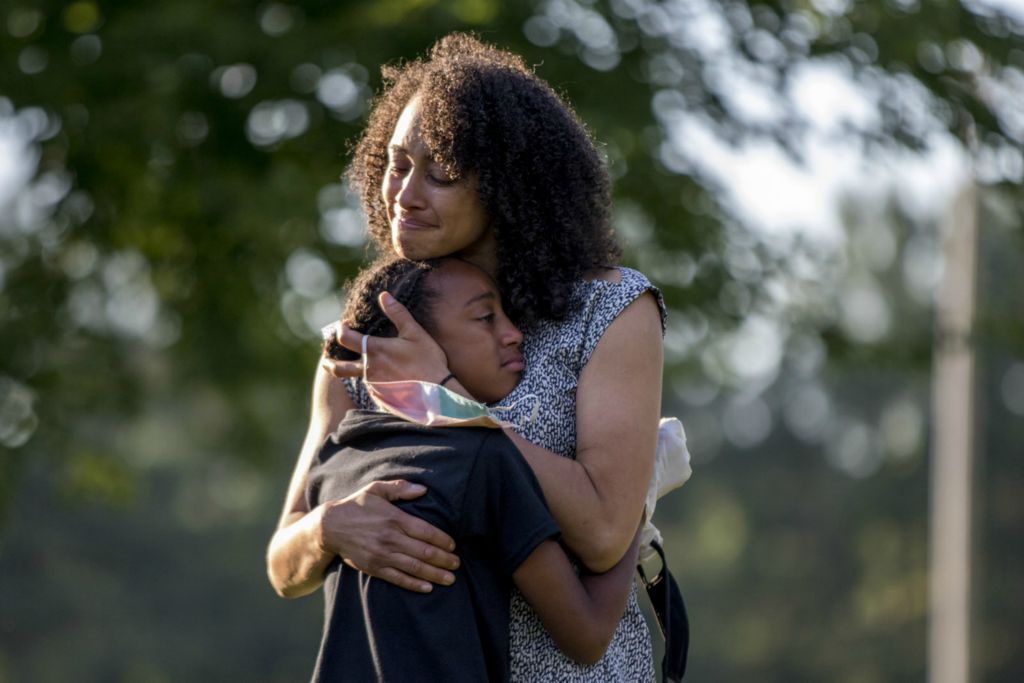 Second Place, General News - Jessica Phelps / Jessica Phelps, “A Mother's Embrace”Dr. Janae Davis embraces her daughter, Mara Royster after she spoke at a forum her older sister, Jadyn Paige, organized. Royster spoke about how her mom helped her to love herself. The Students Against Racism Forum was held at Geller Park in Heath June 24, 2020. The event has been one of many peaceful events in Licking County. The goal of the forum was to create an open dialog about race and a safe space for students to share their experiences.